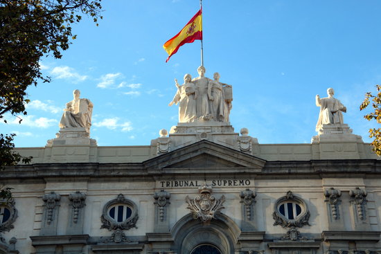 The Spanish flag flies above the Supreme Court in central Madrid
